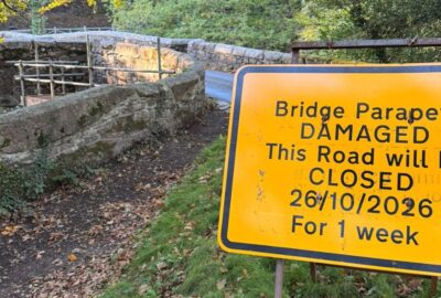 Sign at Holne Bridge stating when the bridge will be closed
