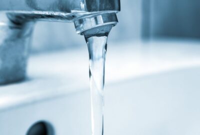 A tap with water pouring out of it
