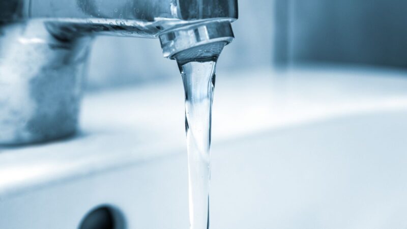 A tap with water pouring out of it
