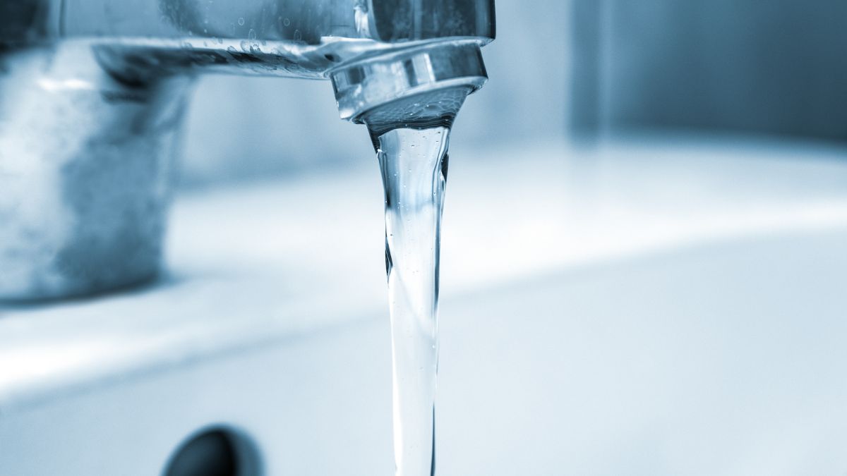 A tap with water pouring out of it