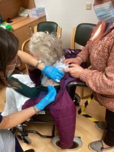 care home resident receiving vaccination