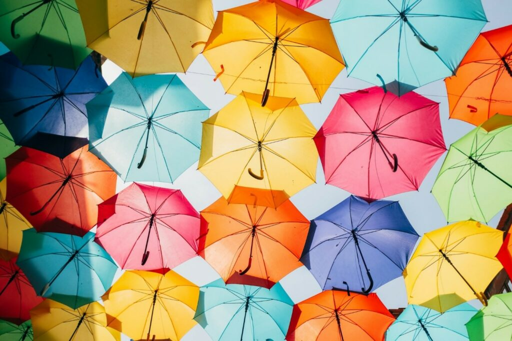 Picture of different coloured umbrellas forming a canopy
