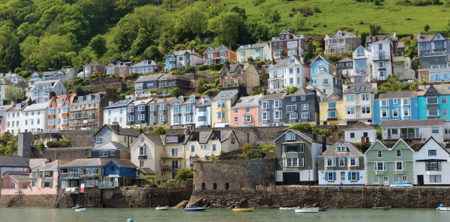Bayard's Cove Fort Dartmouth Devon with houses on the hillside in historic English town with the River Dart