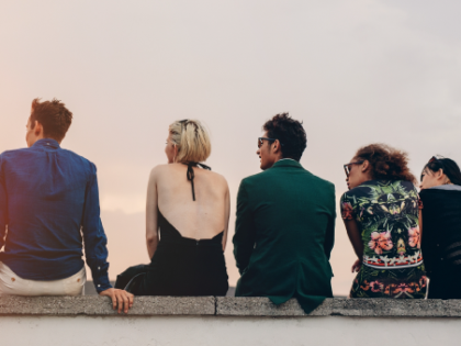 group of students looking out into the sunset