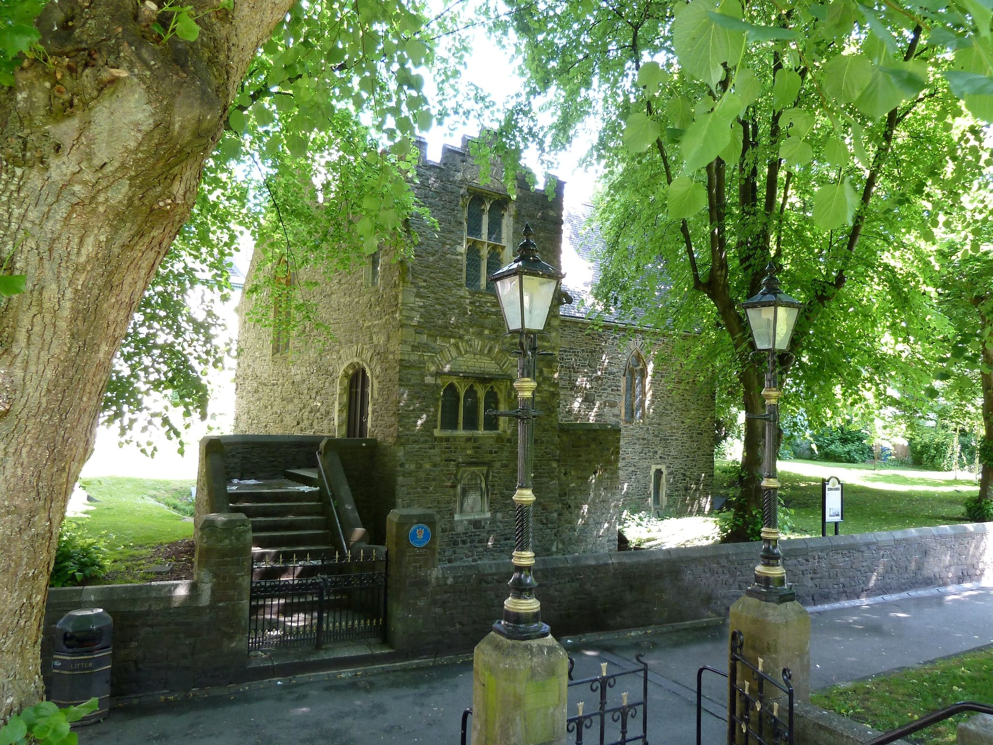 A stone church with steps leading up to it.