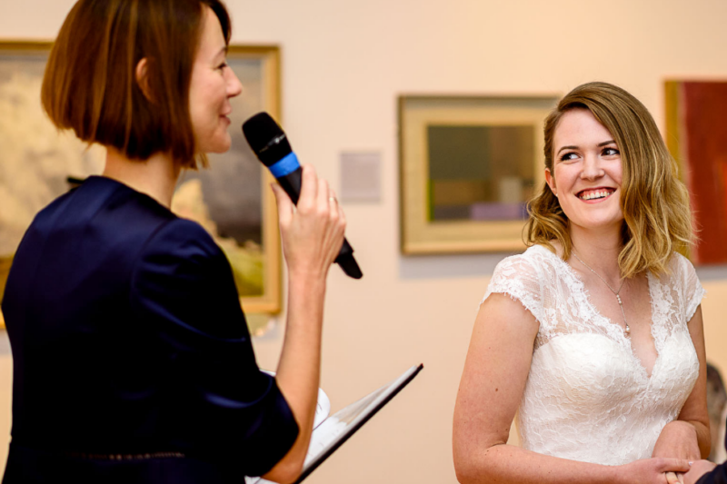 A registrar conducting a ceremony while the bride looks on