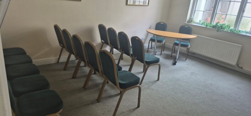 The Nash Room at Follaton House with chairs and table set out for a ceremony