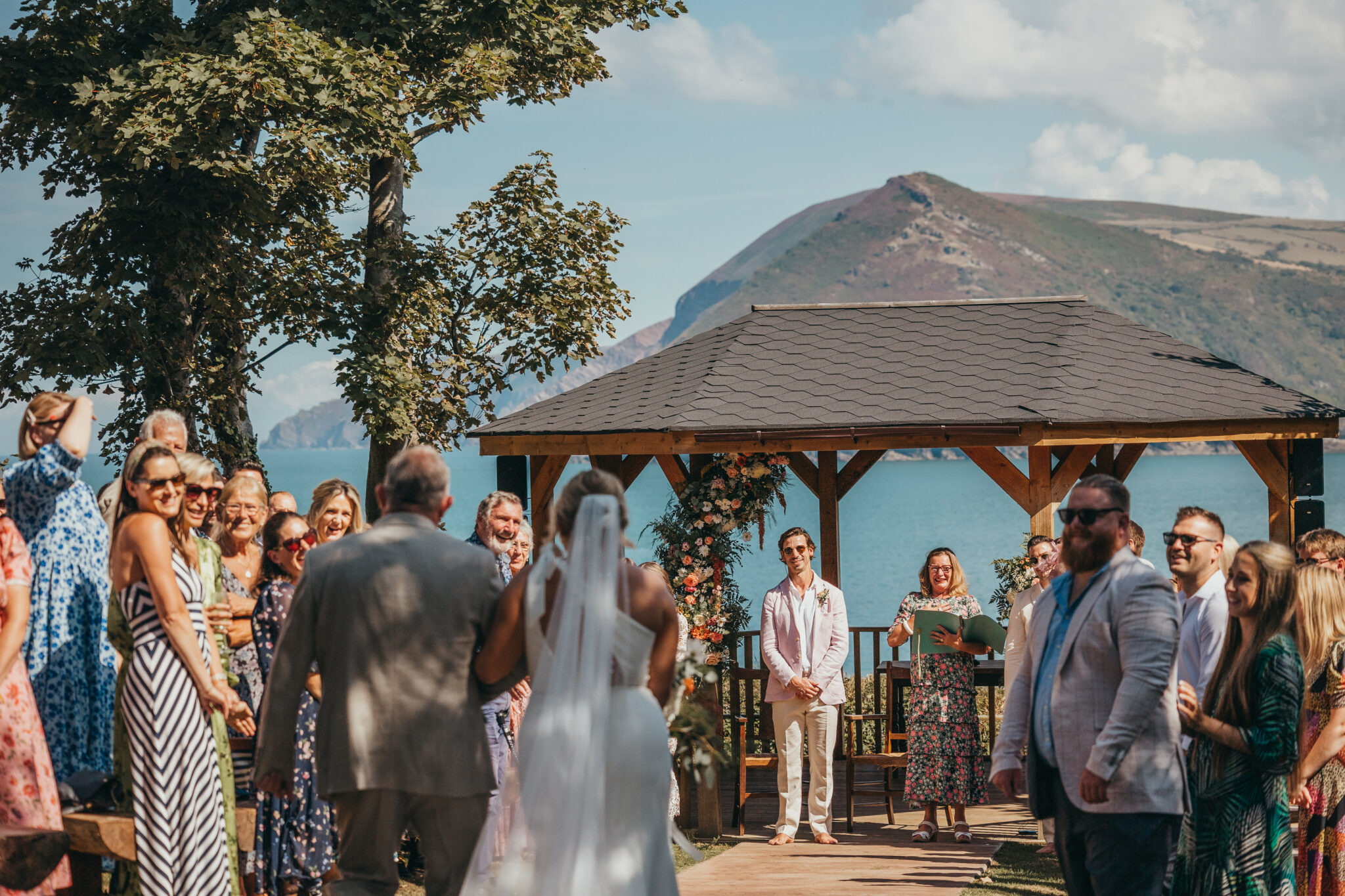 Wedding at Watermouth Cove with guests and bride and groom