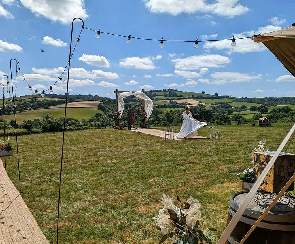 A wedding taking place outside at Deer Farm.