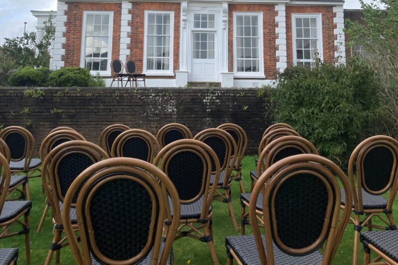 Chairs set up for a ceremony on the outside patio at County Hall