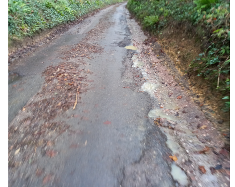 Image shows unsurfaced road 