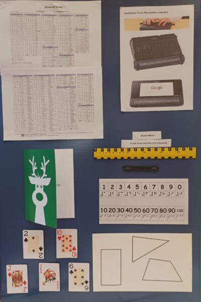 information board displaying equipment needed for braille