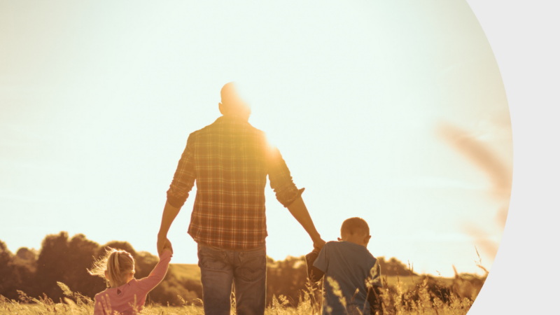 A family walk through a field.