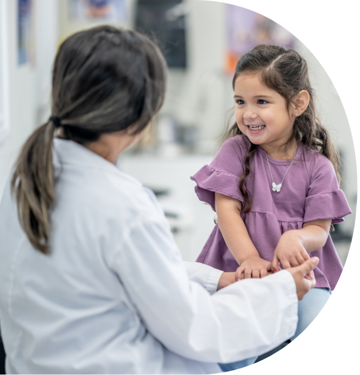 Picture in the shape of a D, featuring a practitioner facing a child, holding their hands.