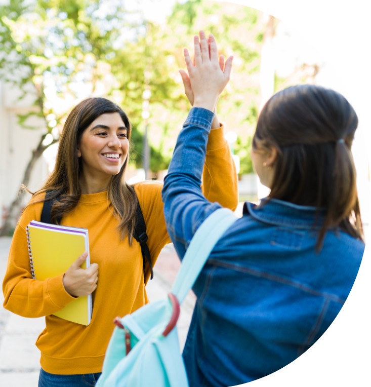 two students high fiving
