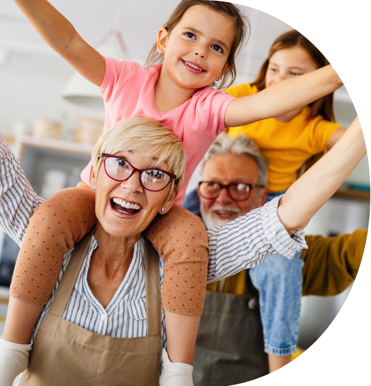 grandparents with their grandchildren on their shoulders