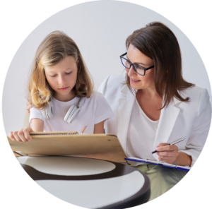 social worker and child writing on some paper