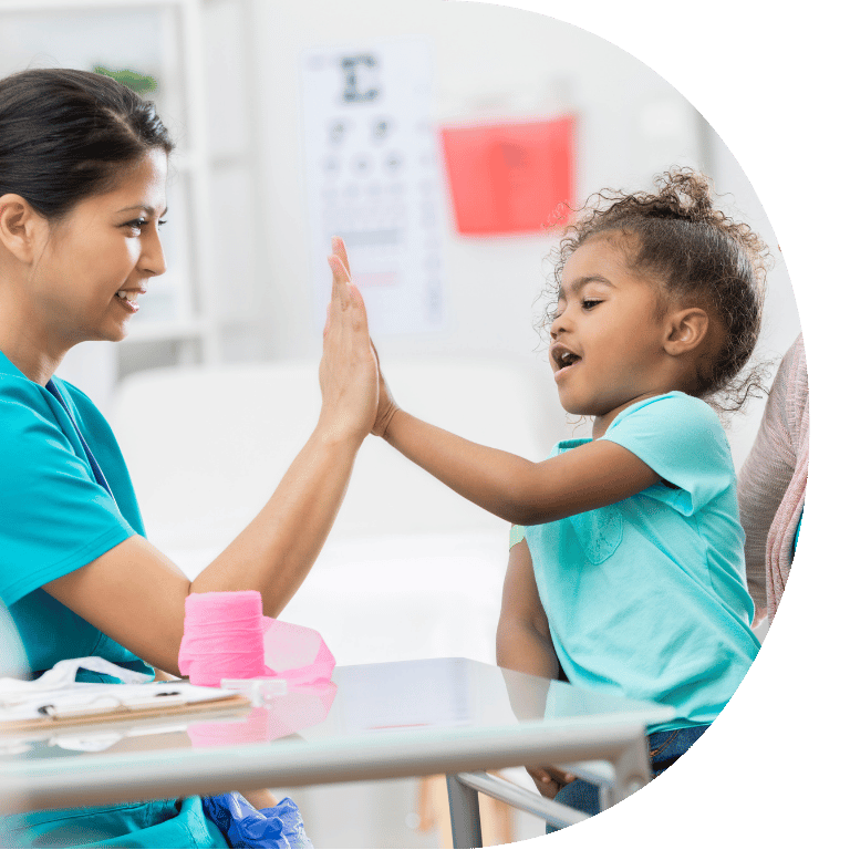 The image is cropped to a D shape and shows a nurse and young girl high fiving.