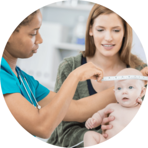 Image is cropped to a circle and shows a nurse measuring a babies head