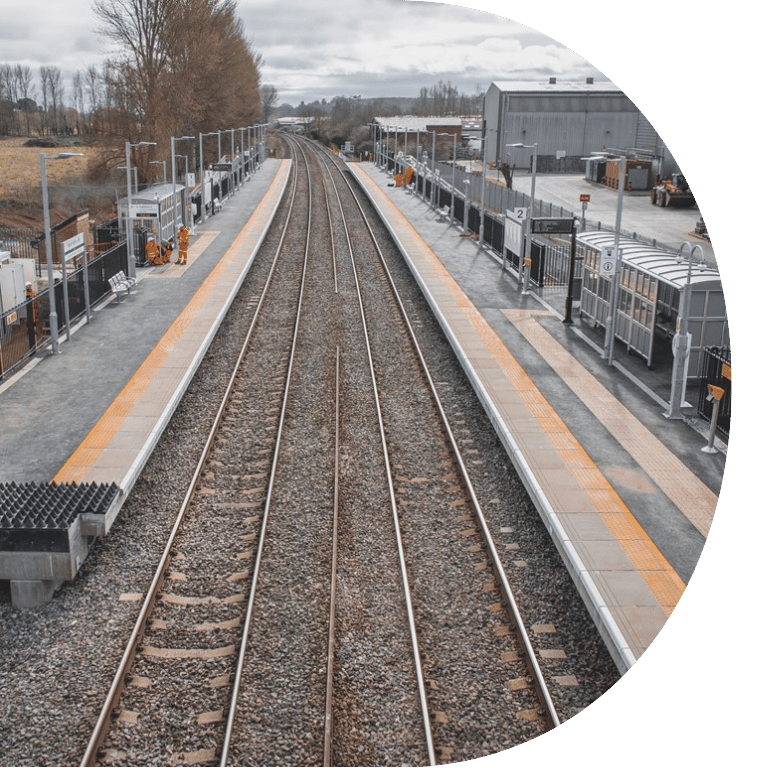 Image is cropped to a D shape and shows Marsh Barton Railway Station
