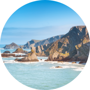 Views of the cliffs and coastline near near Hartland Quay in North Devon on a sunny day with a blue sky