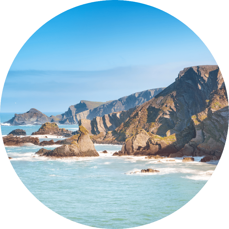 Views of the cliffs and coastline near near Hartland Quay in North Devon on a sunny day with a blue sky