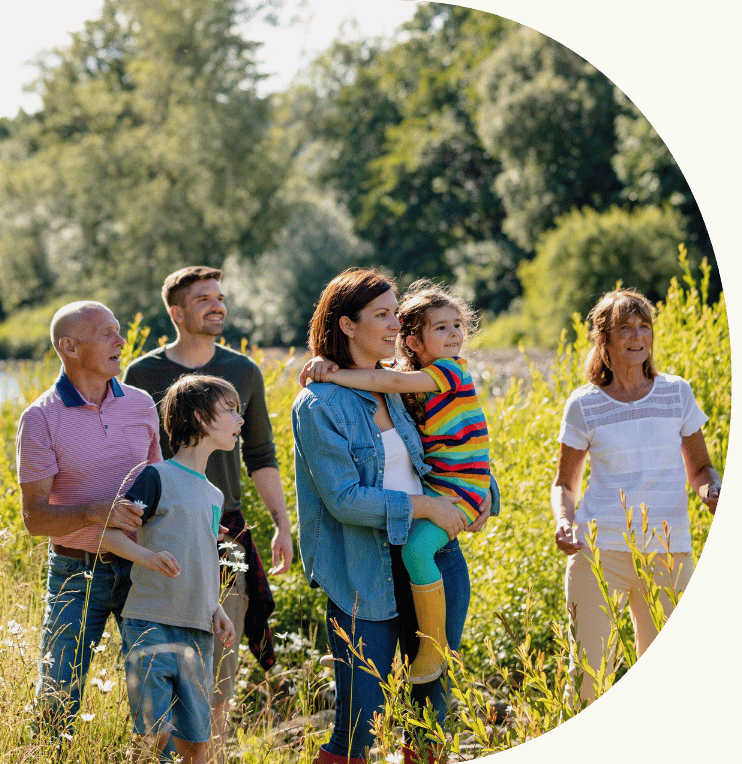 A family out for a walk in the countryside.