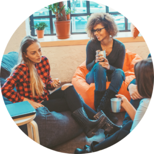 Group of young adults sat on beanbags chatting