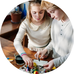 two young teens doing some arts and crafts