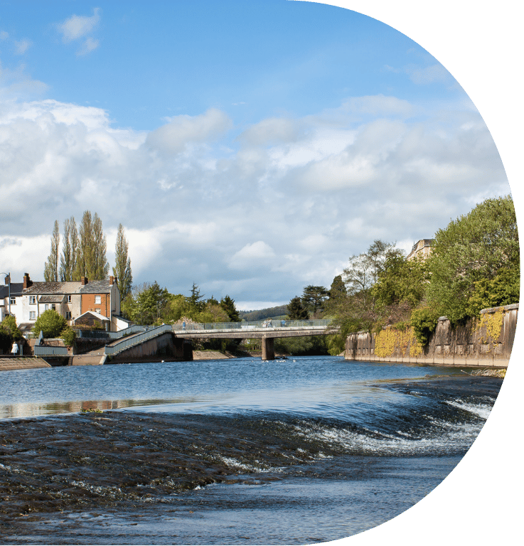 Picture taken in Tiverton of the River Exe and a bridge in the background.