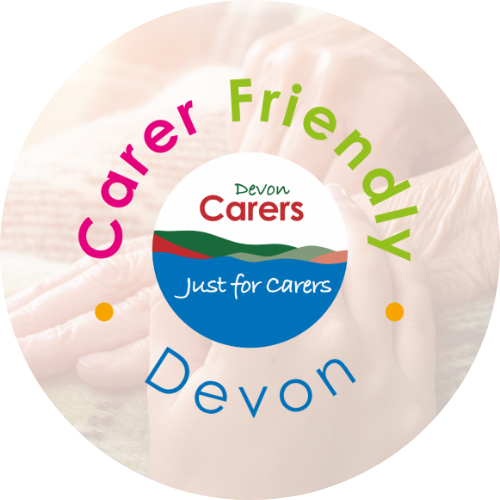 image of people holding hands with the carer friendly devon logo on top of the image