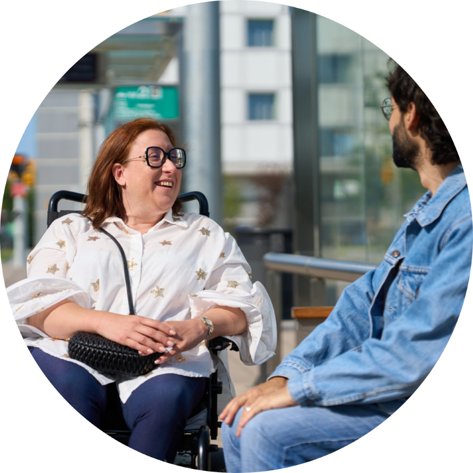 Picture of two adults sitting talking to each other